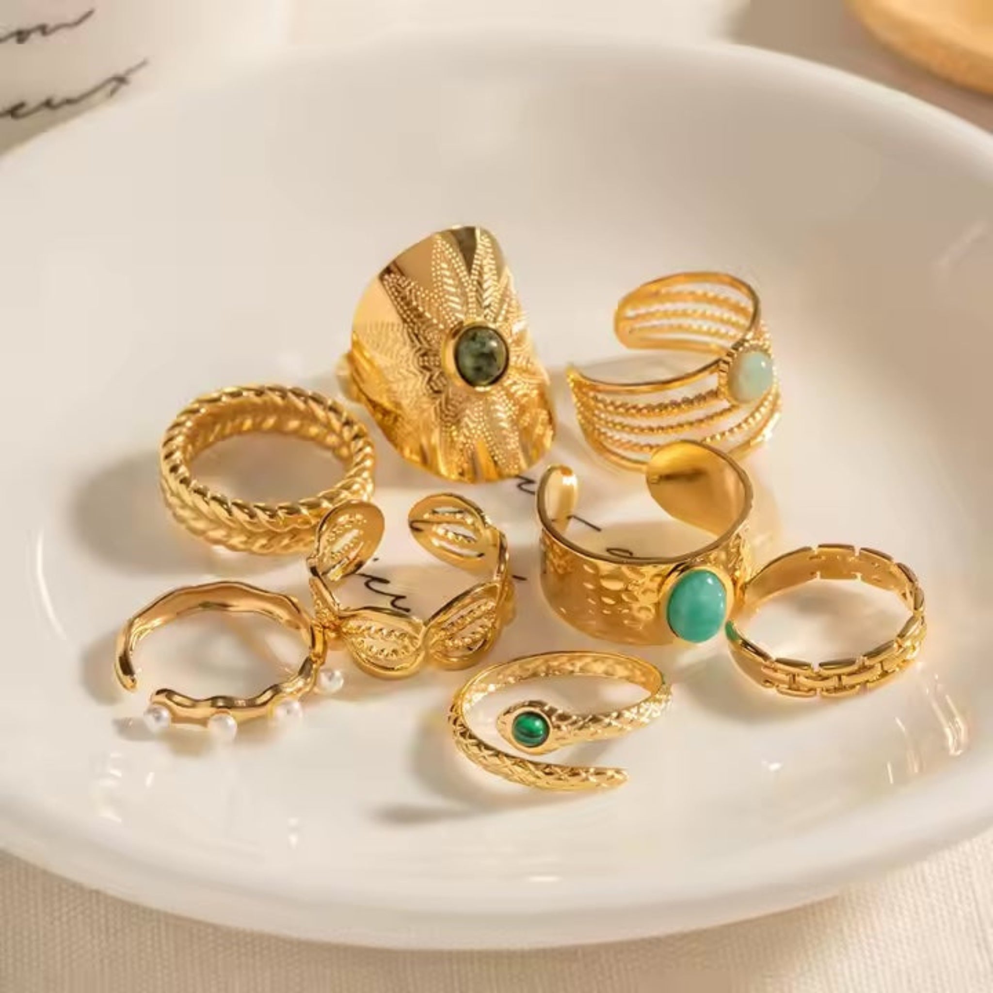 Assorted rings on white plate