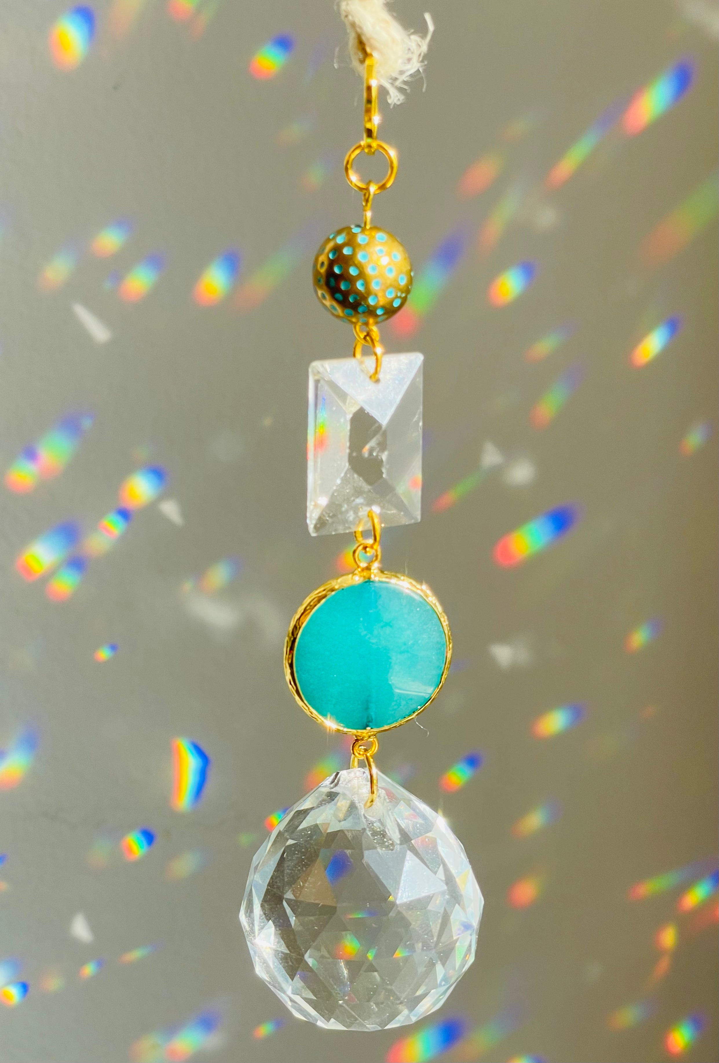 Blue Agate Big Crystal Hanging oRnament in front of white surface