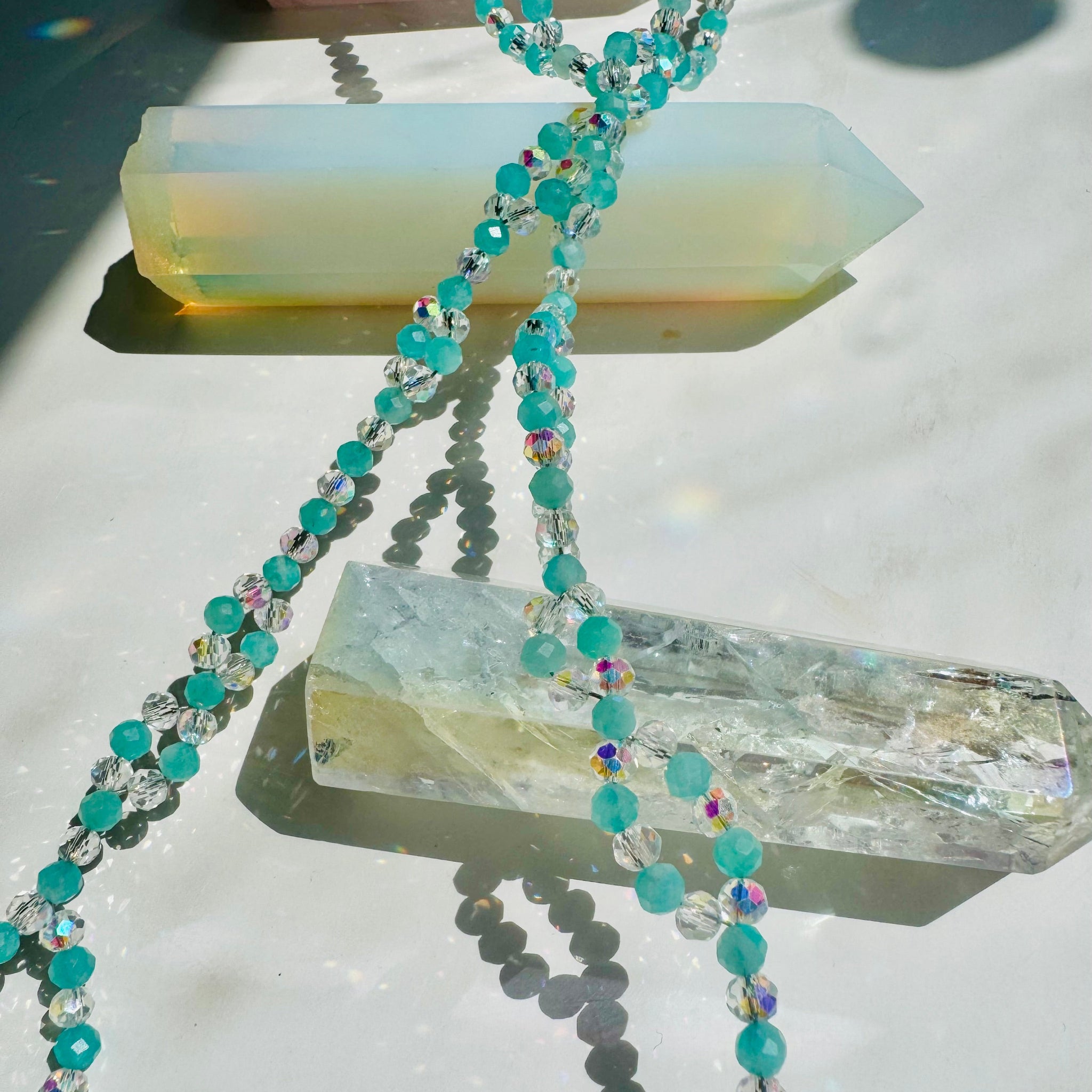 Closeup Clarity Amazonite Tantric Necklace on crystals