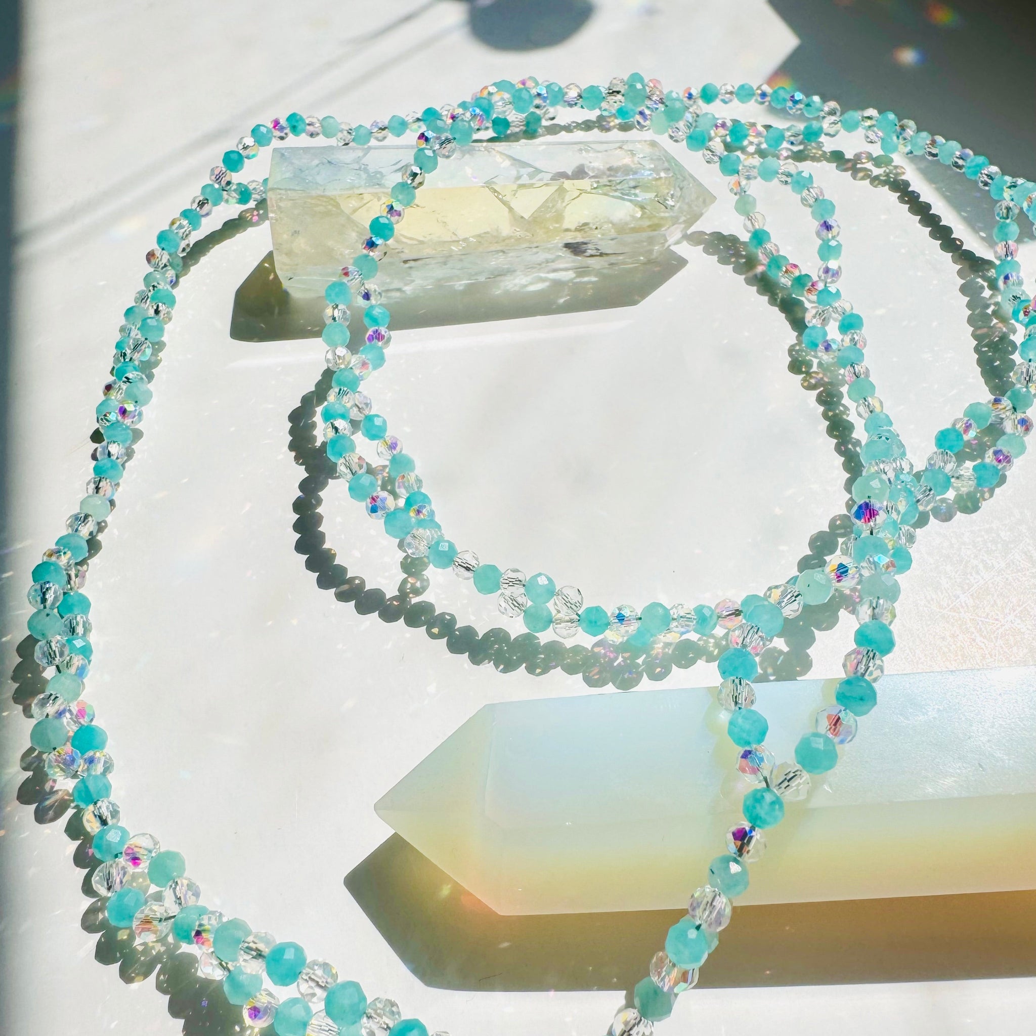 Clarity Amazonite Tantric Necklace
on white surface with white crystals