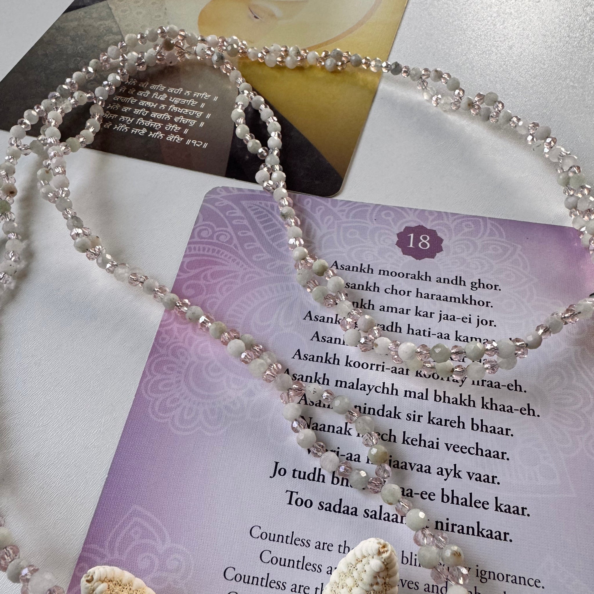 Kunzite Tantric Necklace on mantra card with closeup photo