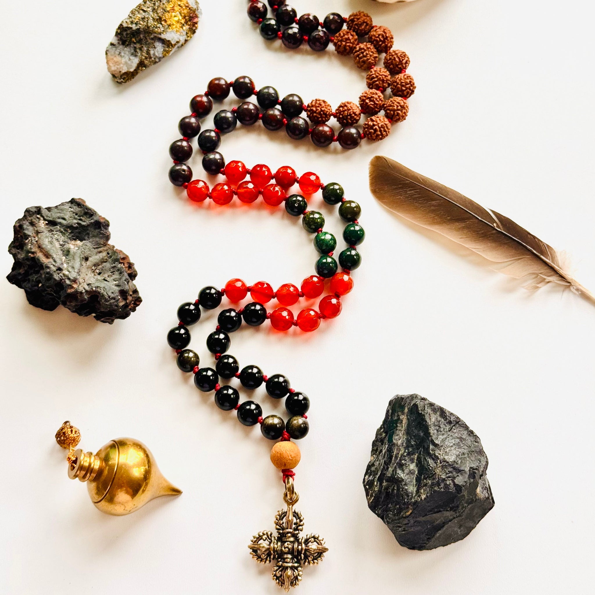 Necklace with beads and stones on a white surface