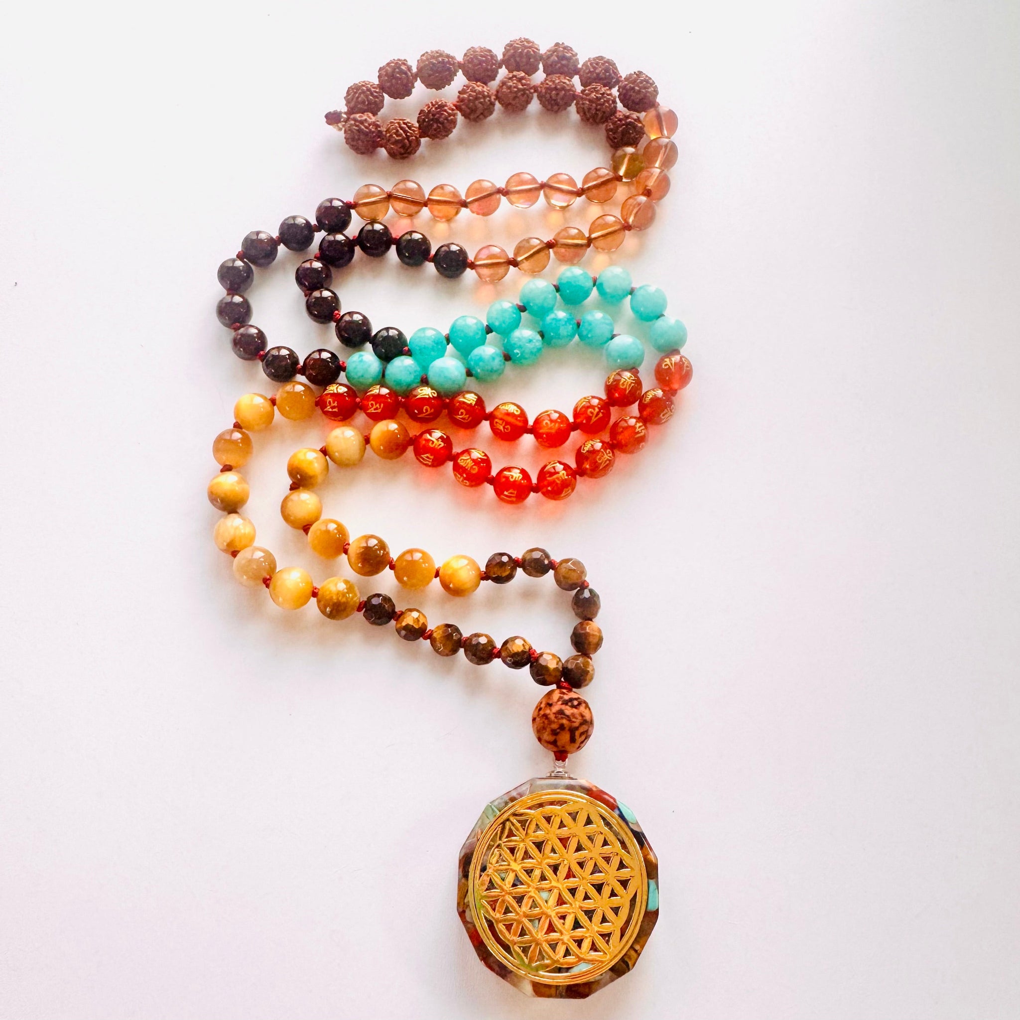Colorful beaded necklace with a yellow pendant on a white background