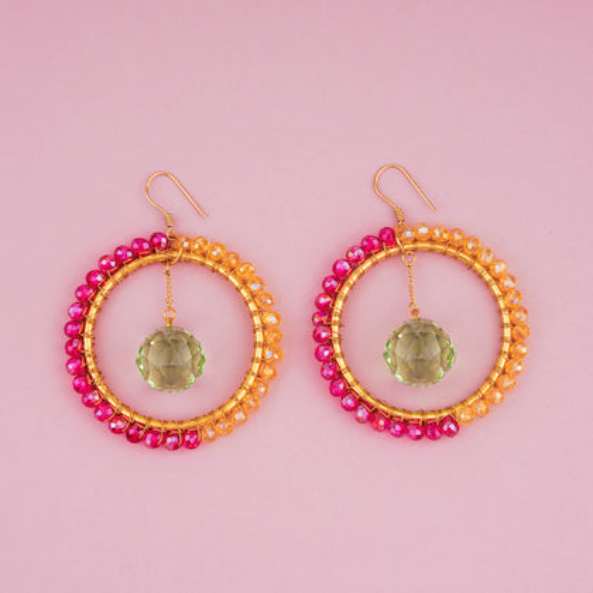 Glamour Suncatcher Earrings onpink surface