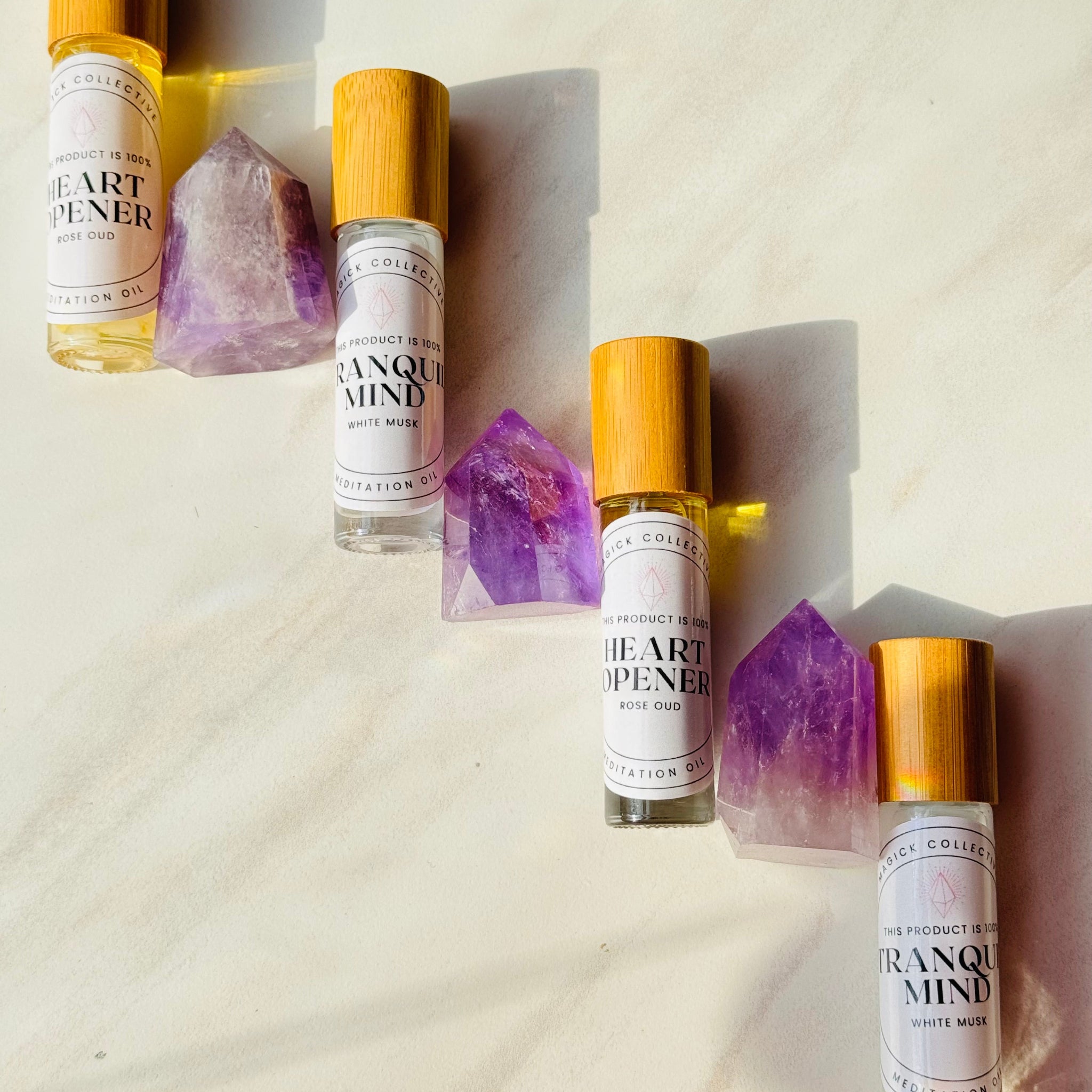 Heart Opener and Tranquil Mind Oils with wooden caps with amethyst