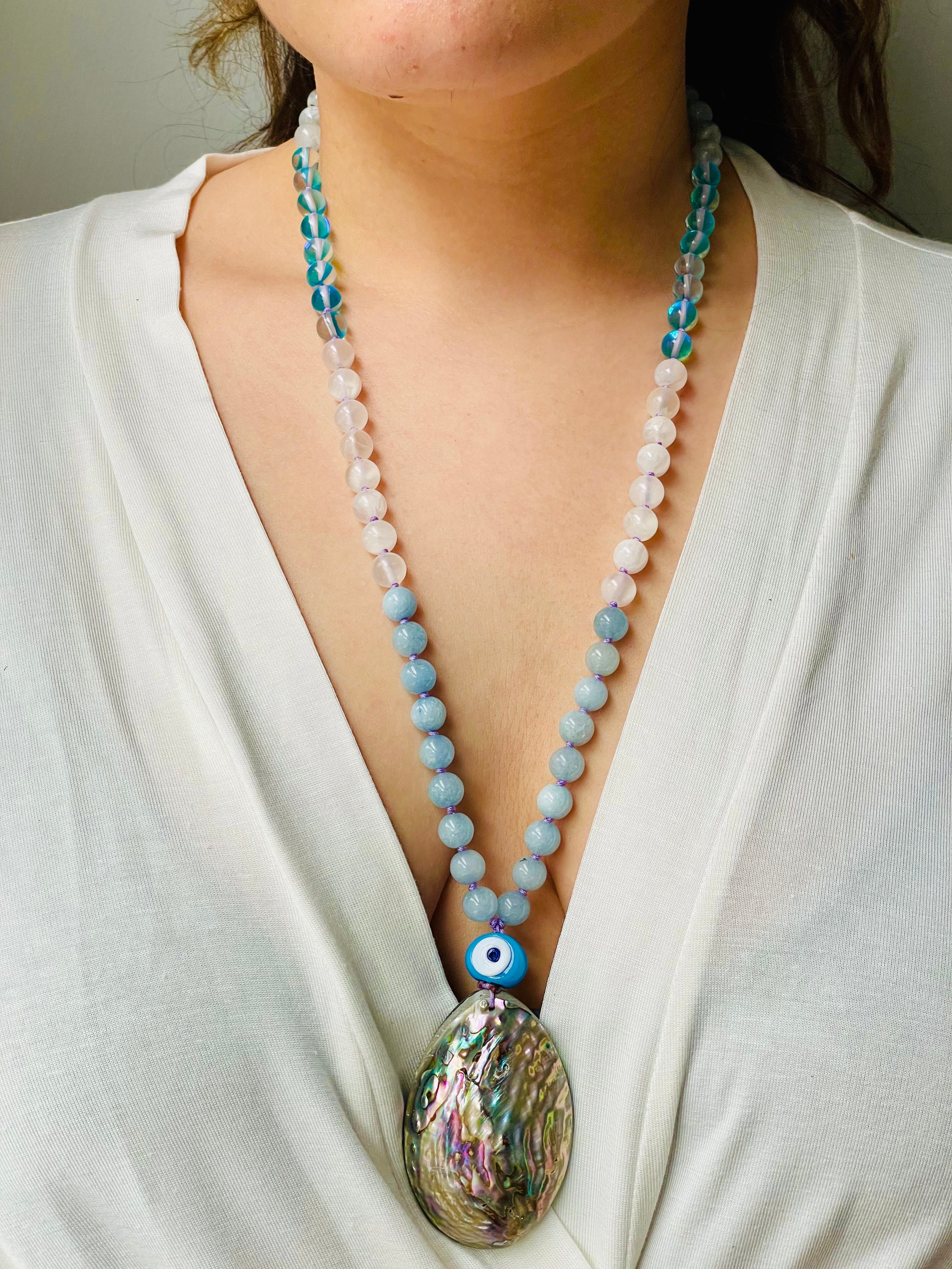 beaded gemstone necklace with shell pendant on model