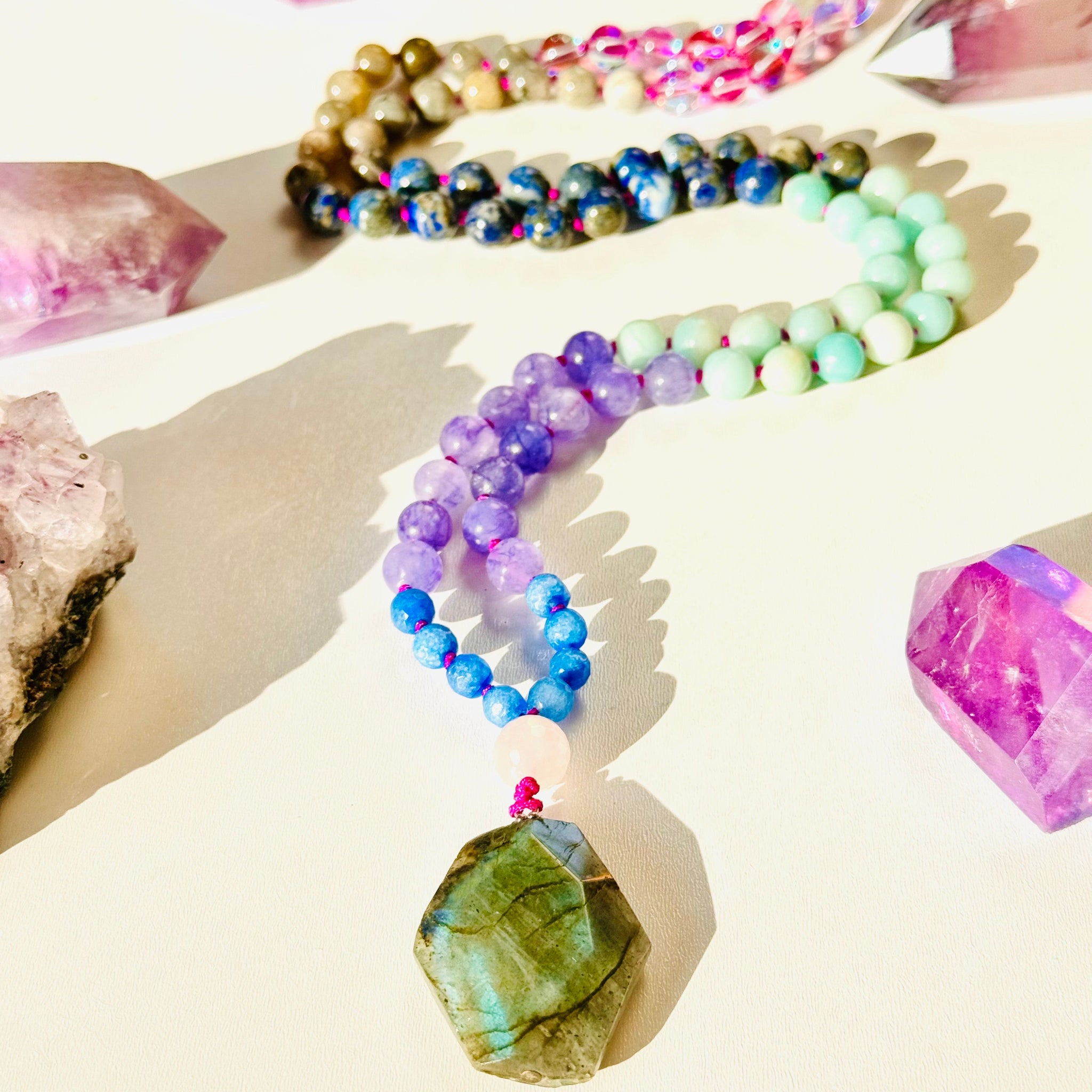 Beaded gemstone mala with blue, purple and grey gemstones