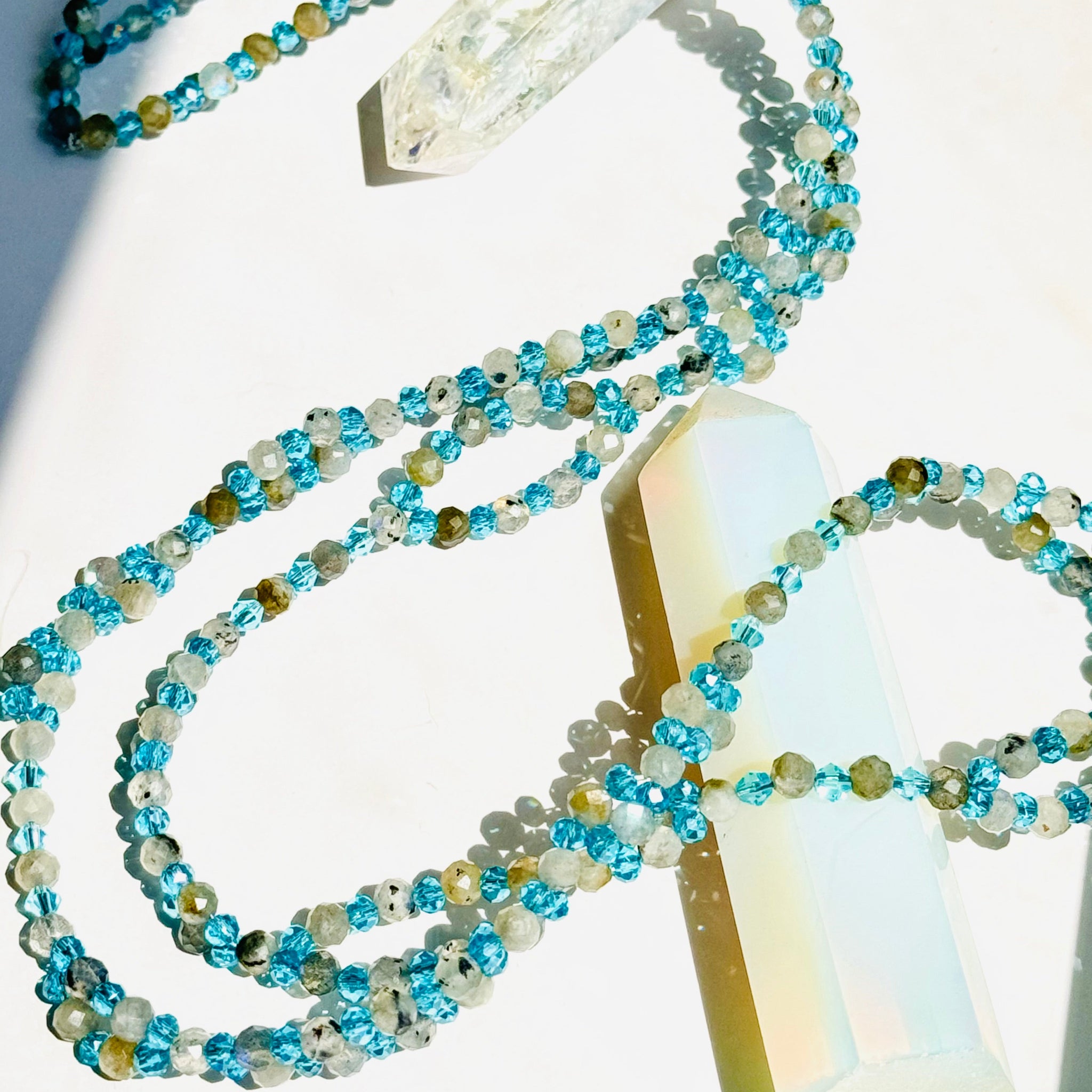 Moonstone tantric necklace closeup photo on white surface