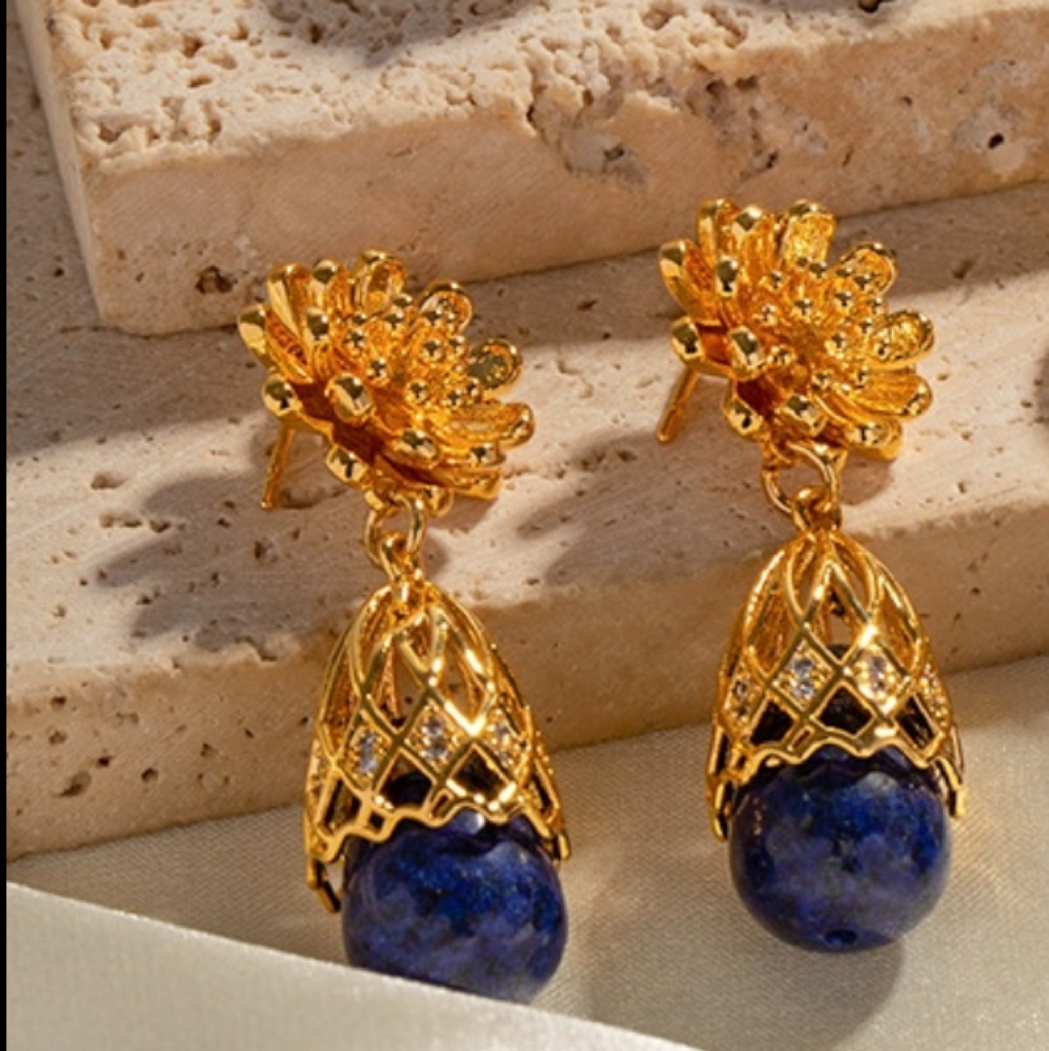 closeup Lapis Bloom Earrings on surface