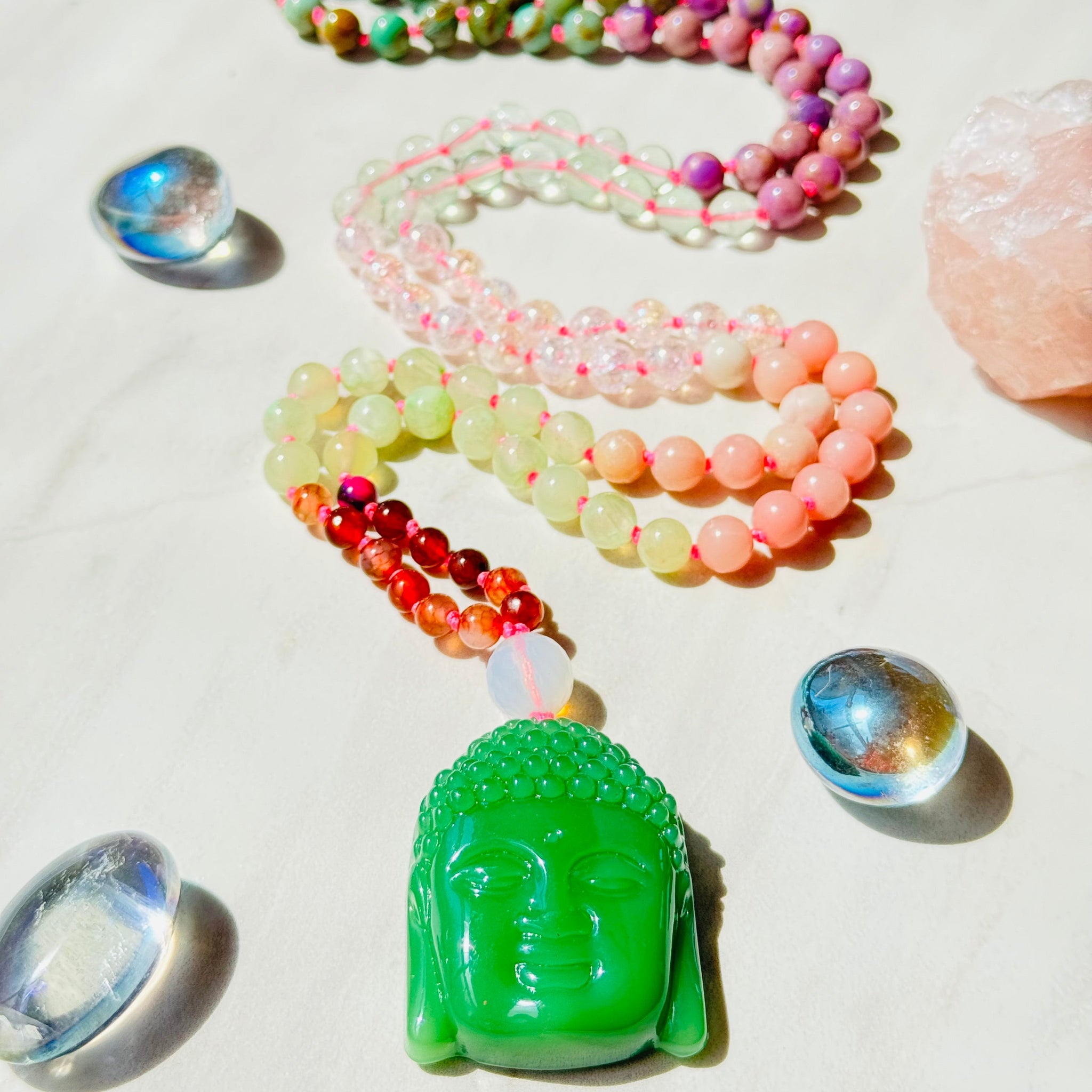 beaded pink gemstones with buddha jade pendant