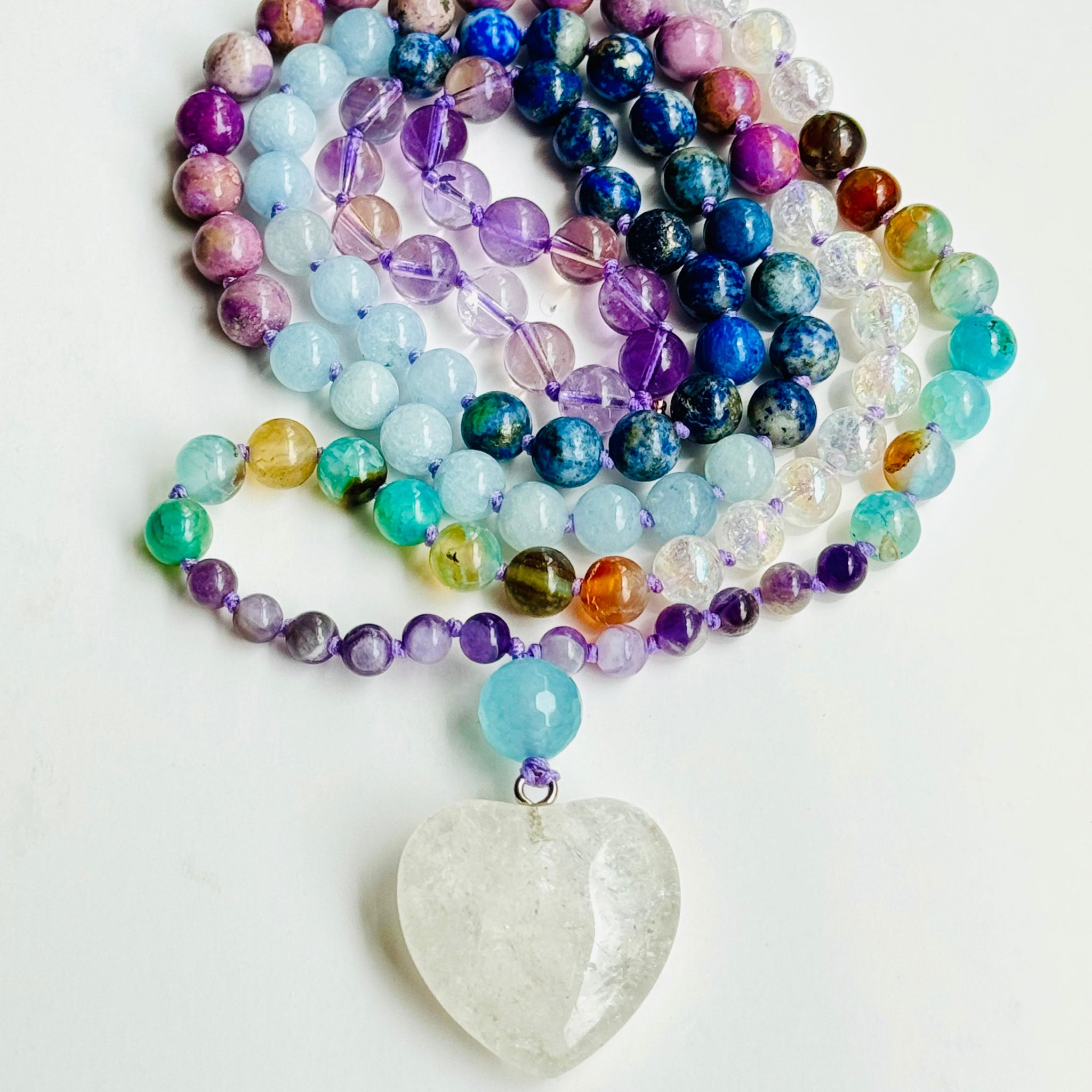 Beaded blue,purple and clear beads with white heart crystal pendant