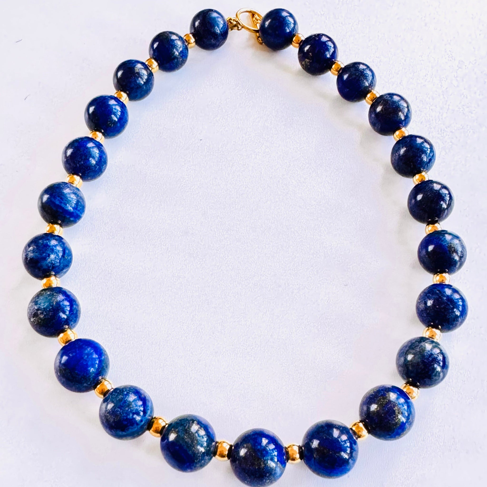 Necklace with blue beads on a white background