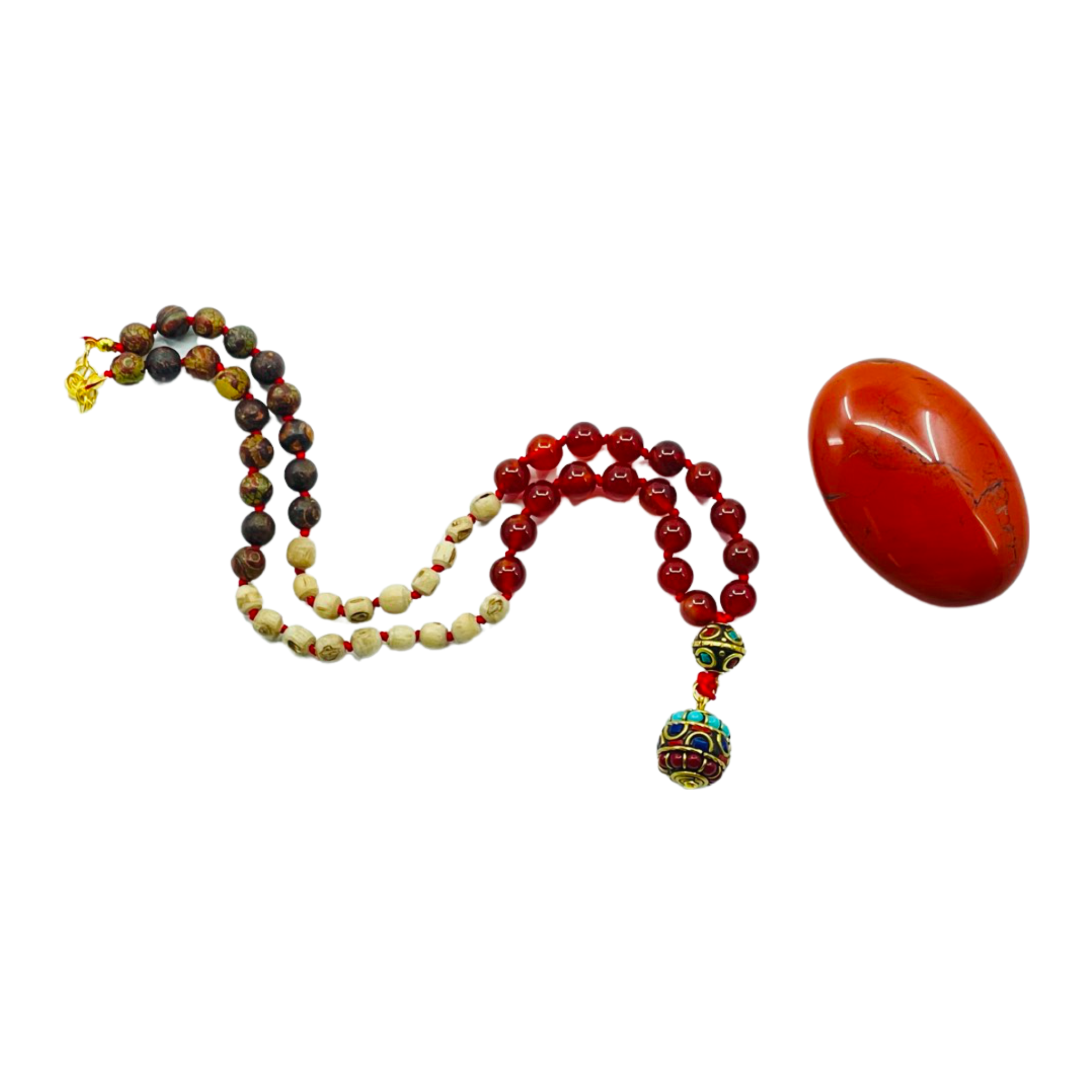 Beaded necklace with a decorative pendant and a large red stone on a white background