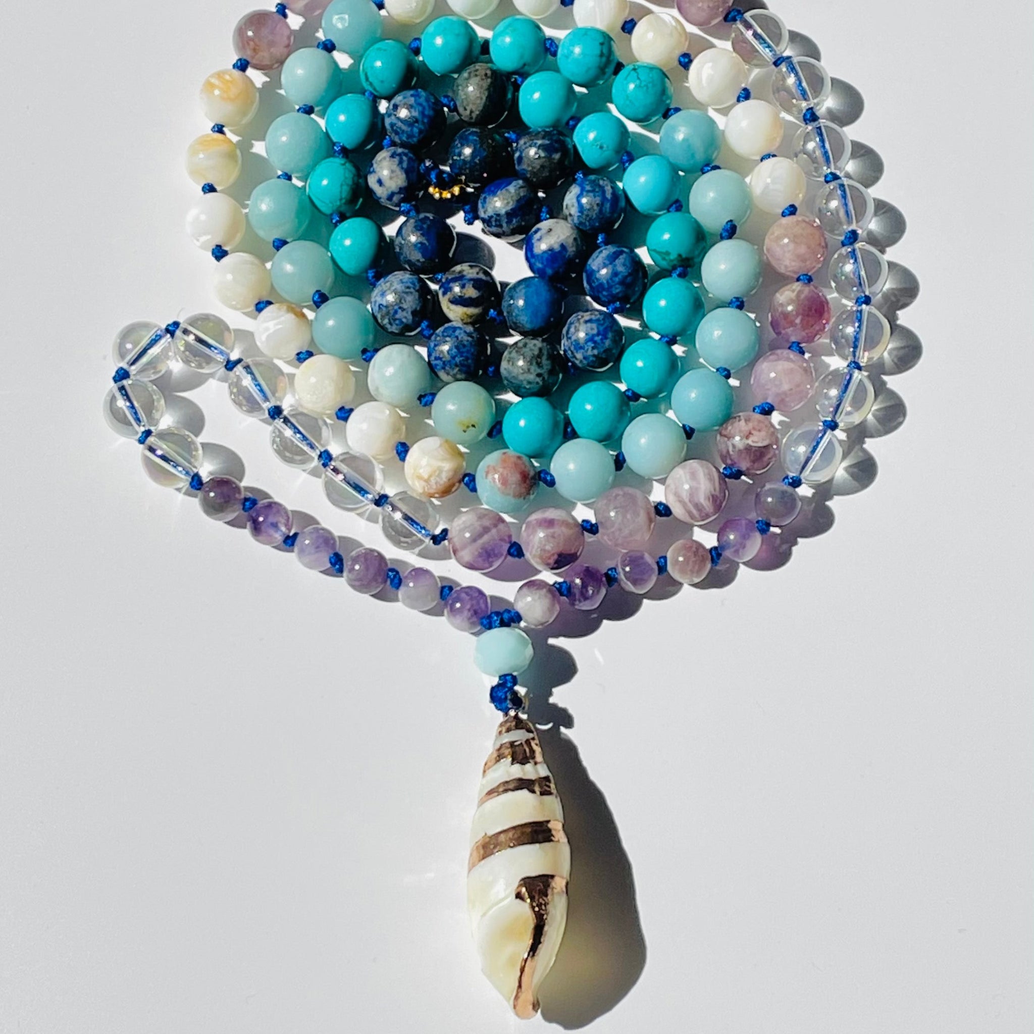 beaded gemstones with seashell pendant