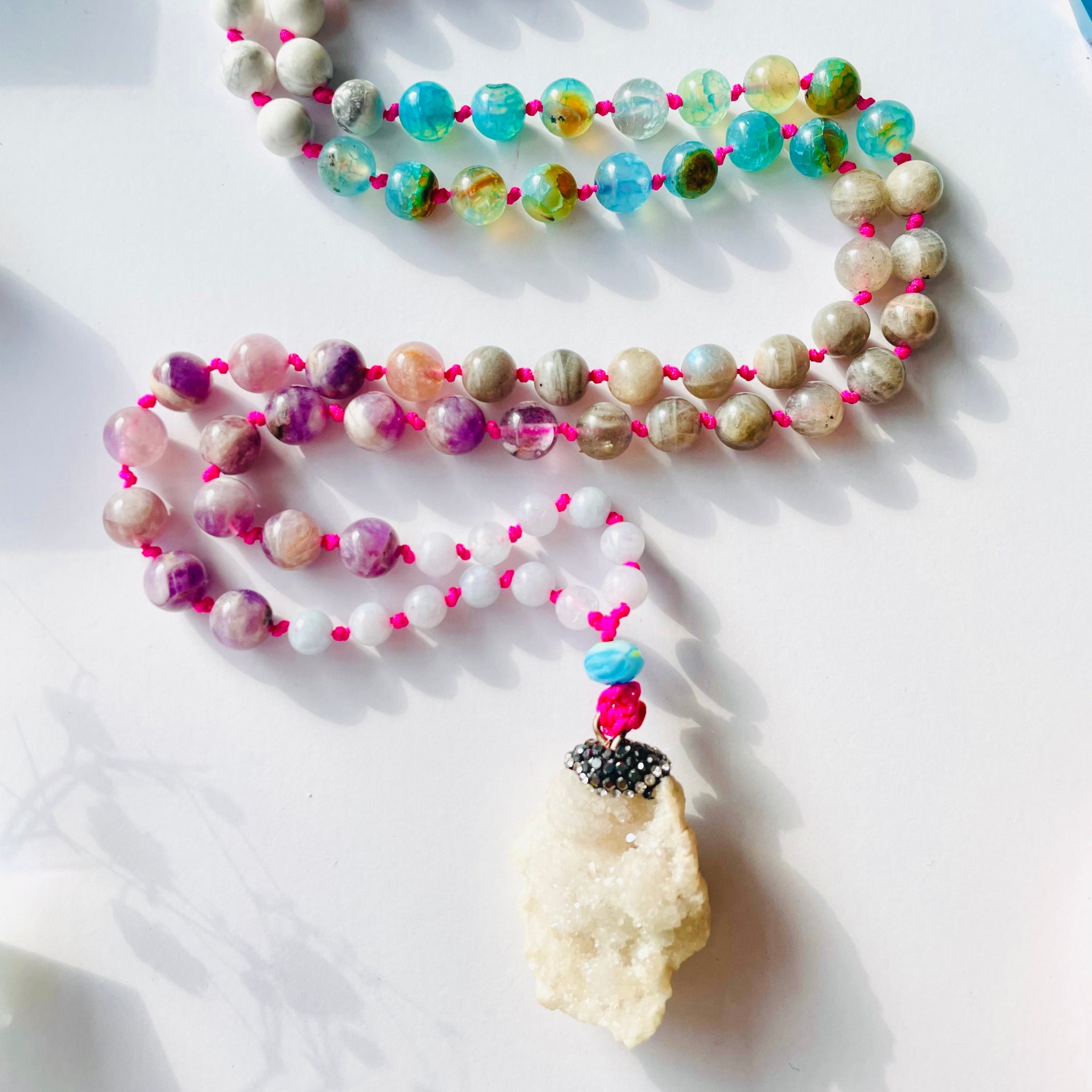 beaded gemstone necklace closeup with pendant