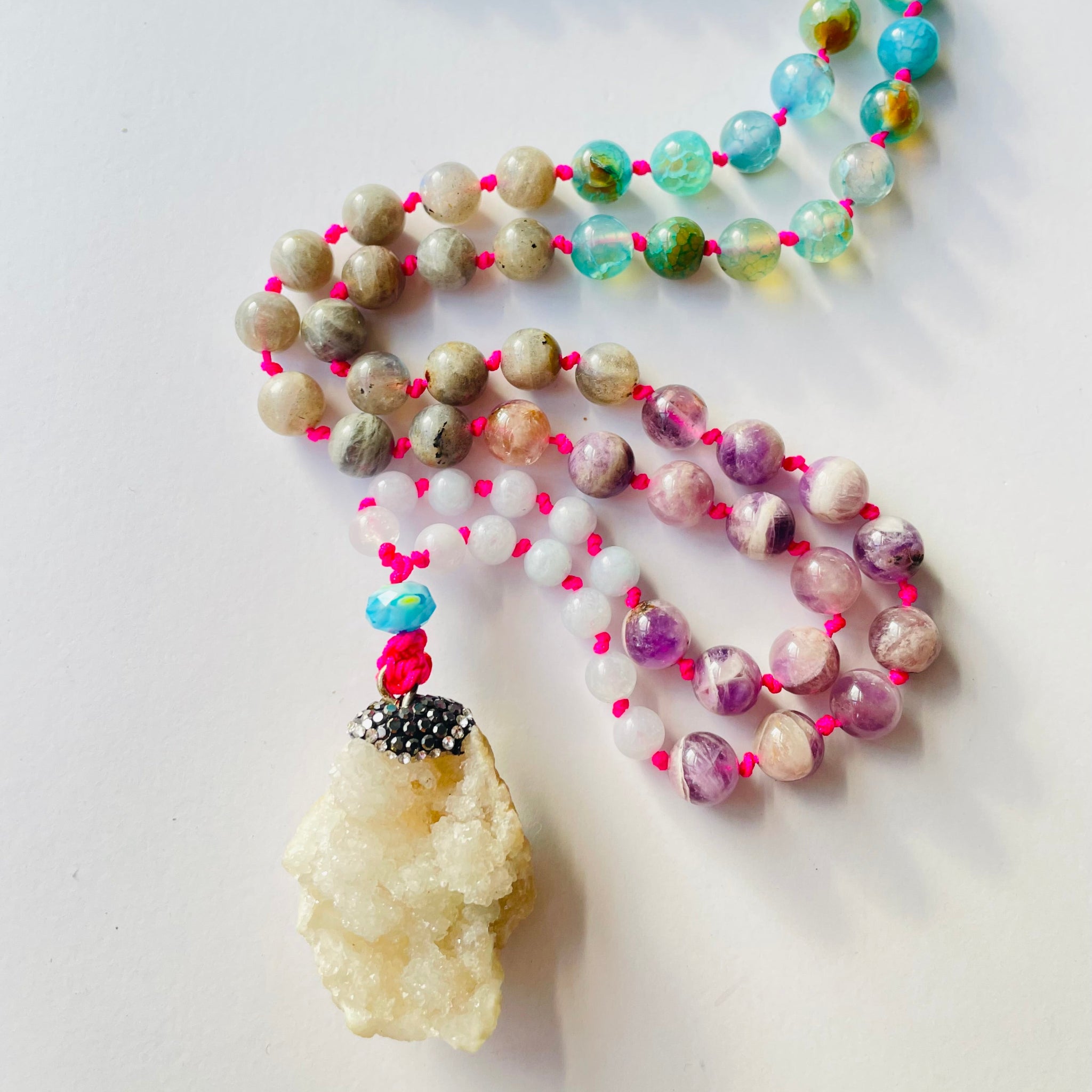 Closeup image of intuitive mala on white surface