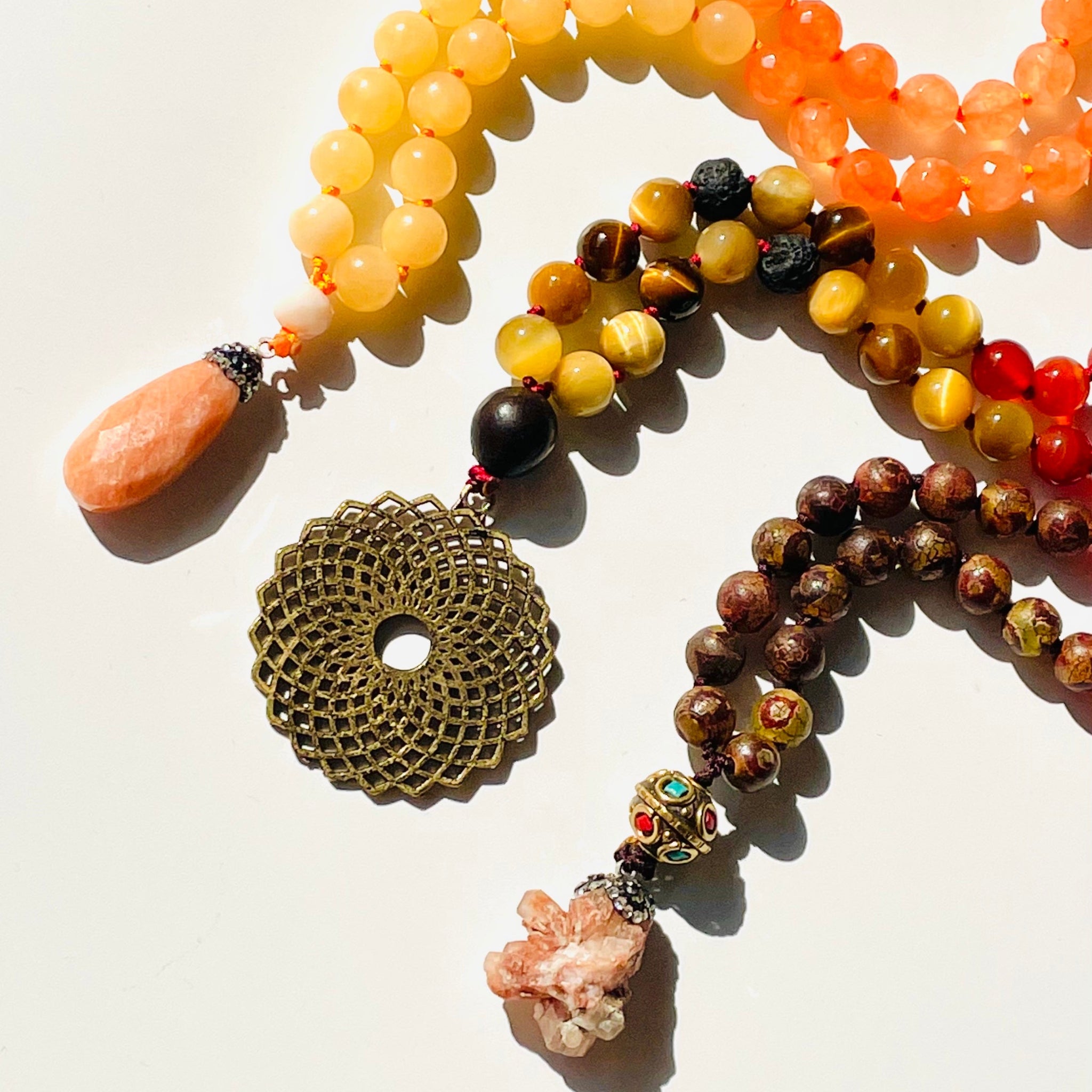 Colorful beaded necklace with a decorative clasp on a light background