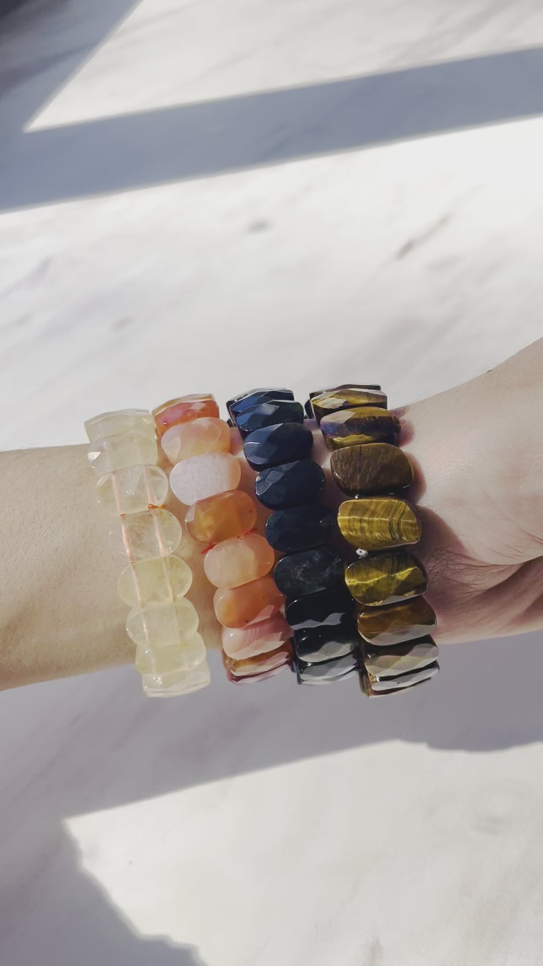 Citrine Carnlian Tigers Eye Obsidian bracelets displayed on arm