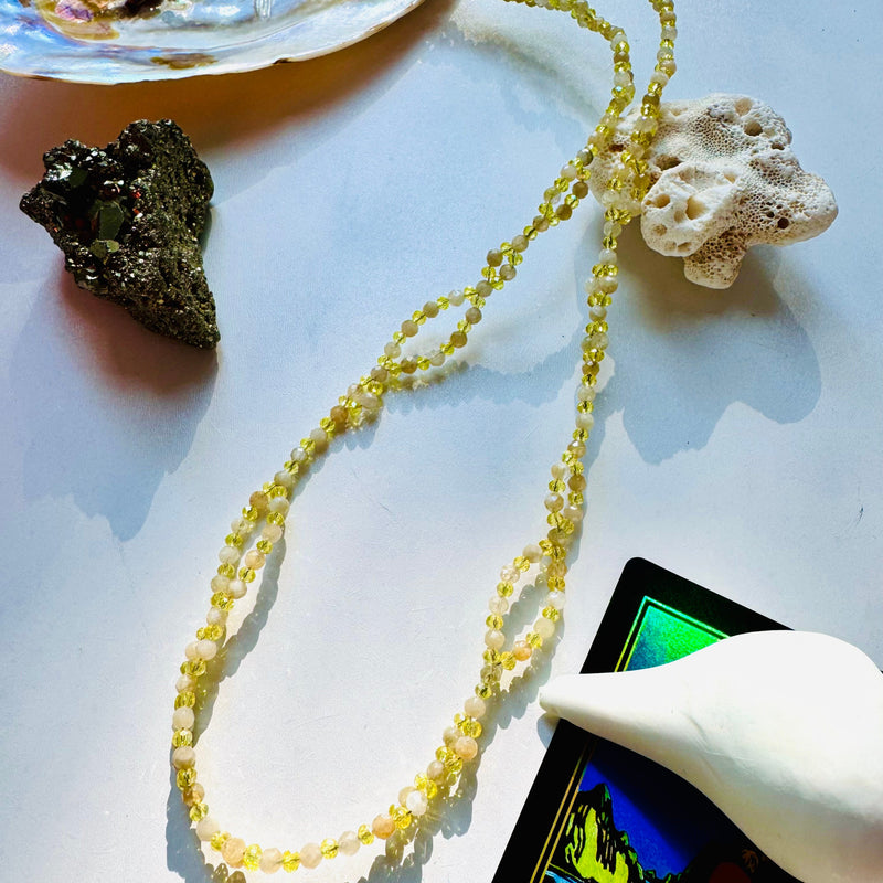 Citrine tantric necklace with black crystal and decorative seashells 