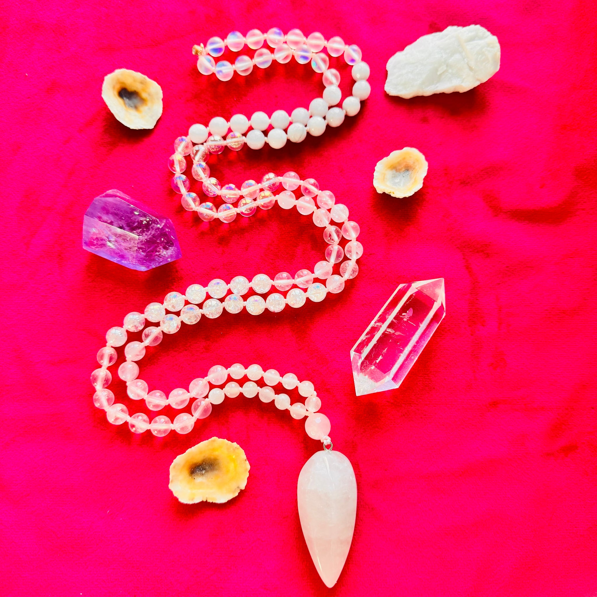 Necklace with crystal pendant on a pink background