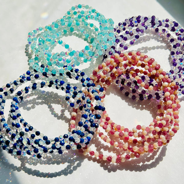 Assorted Tantric Necklaces on white surface