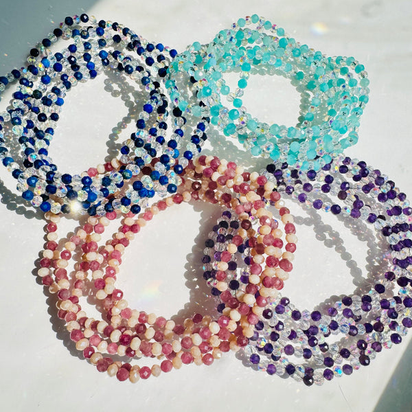 colorful tantric necklace on white surface