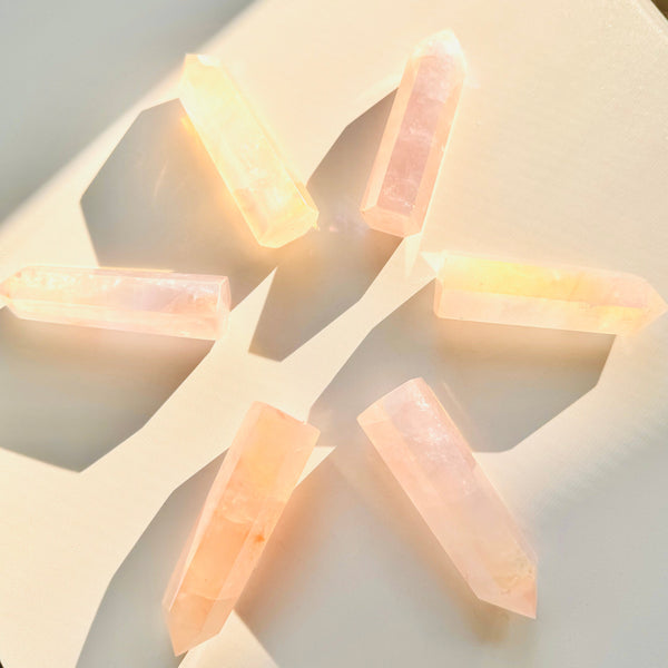 Close-up of Aura Coated Rose Quartz Tower Crystal making a geometric shape