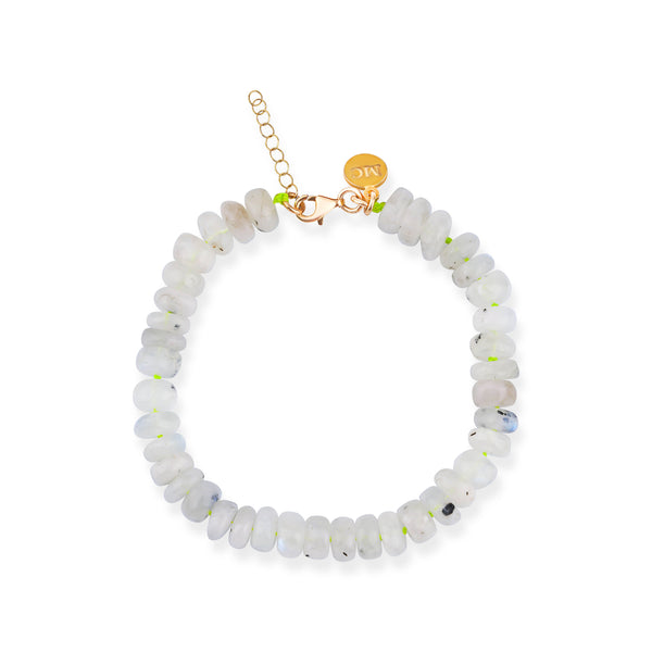A beaded bracelet featuring white and pink moonstone beads on an elastic cord with a gold-tone clasp.