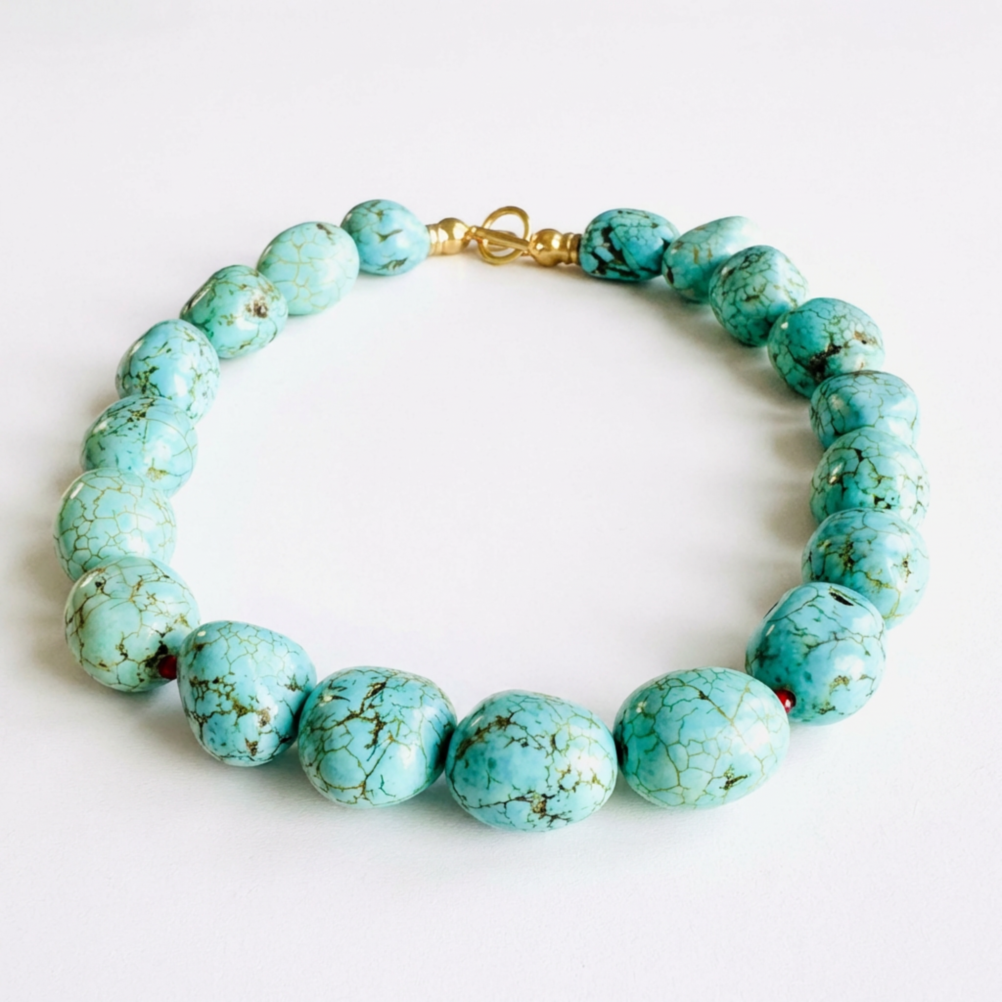 Turquoise beaded bracelet on a white background