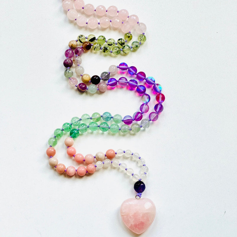 Courageous Heart Mala on white surface