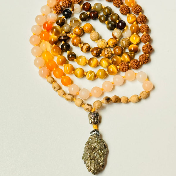 Necklace with multicolored beads and a large pendant on a light background