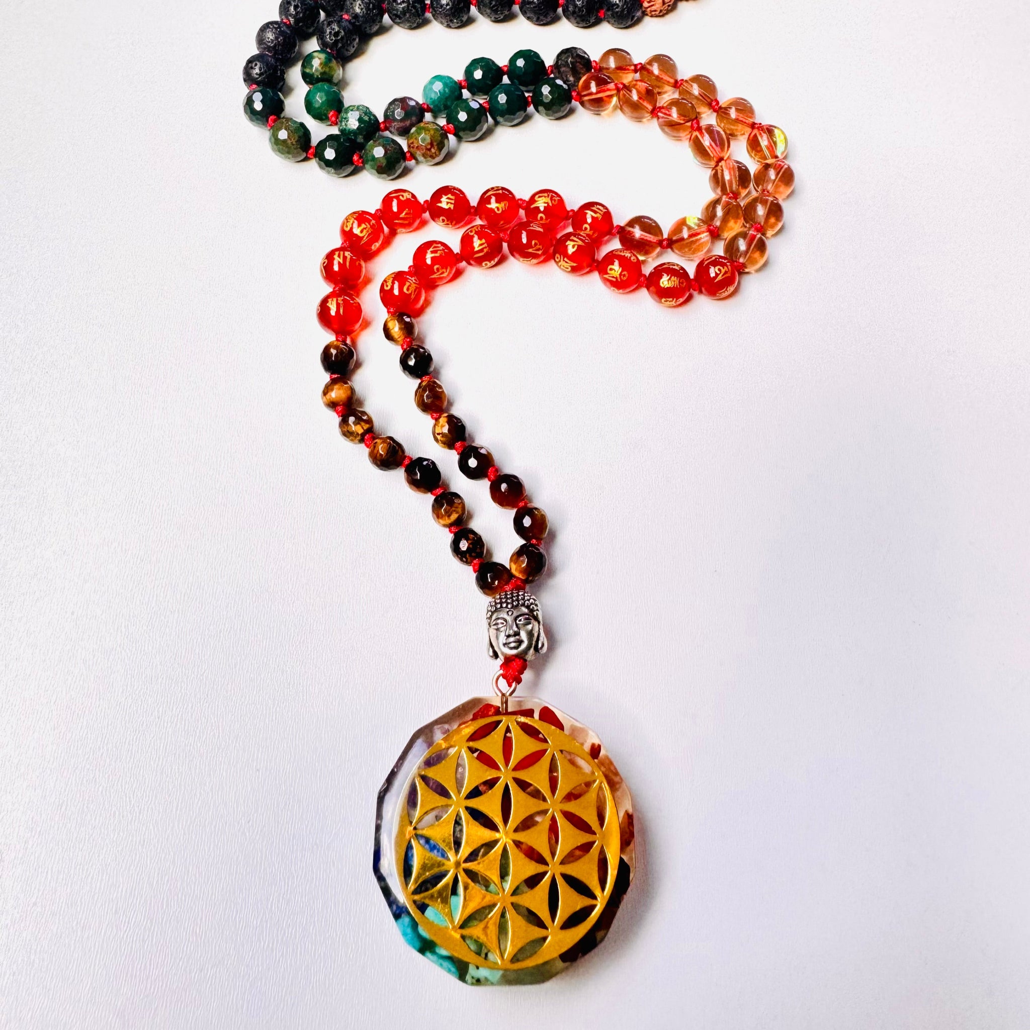 Colorful beaded necklace with a crystal pendant on a white background