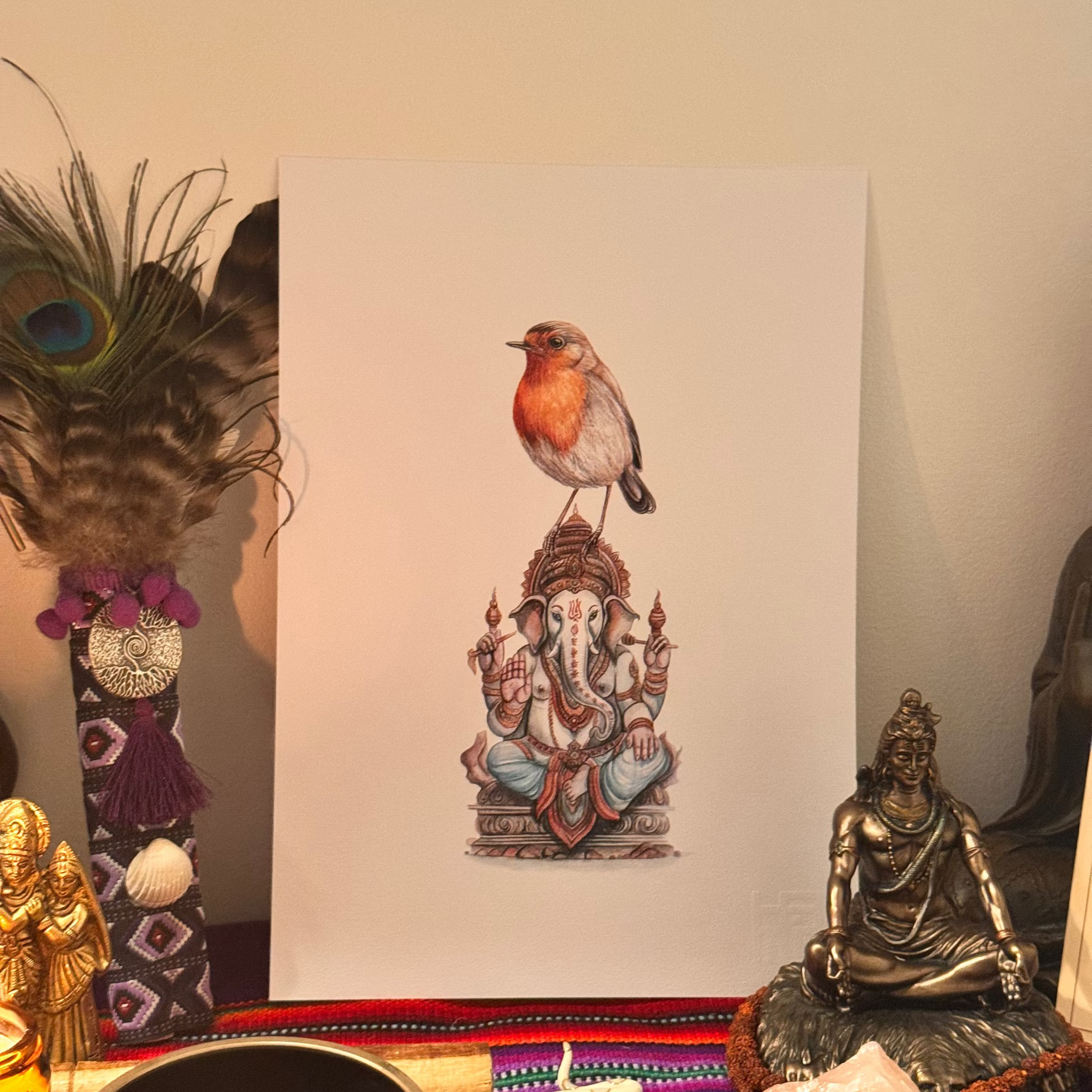Art print of a bird on Ganesha with spiritual items on a colorful mat