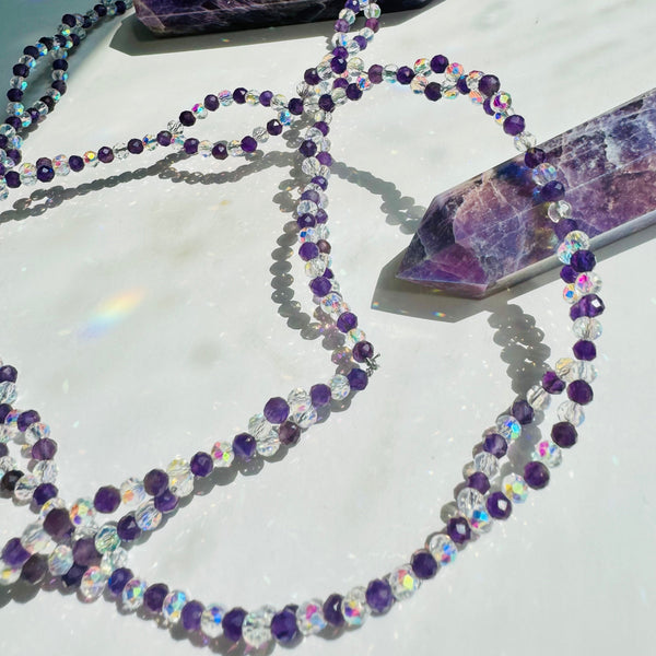 Inner Peace Amethyst Tantric Necklace
on white surface with purple crystal