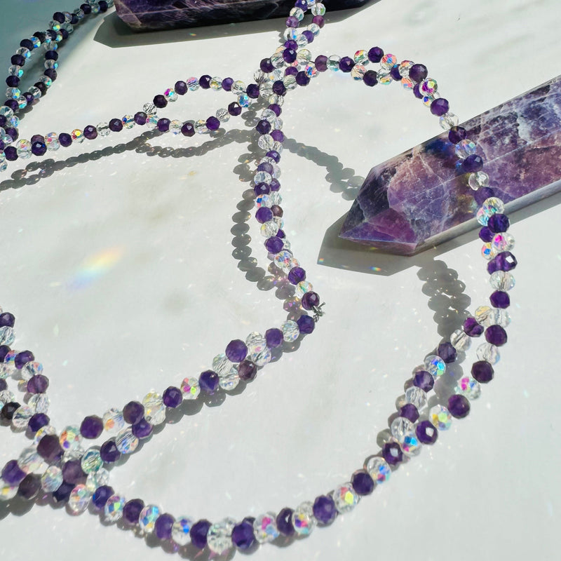 Inner Peace Amethyst Tantric Necklace
on white surface with purple crystal