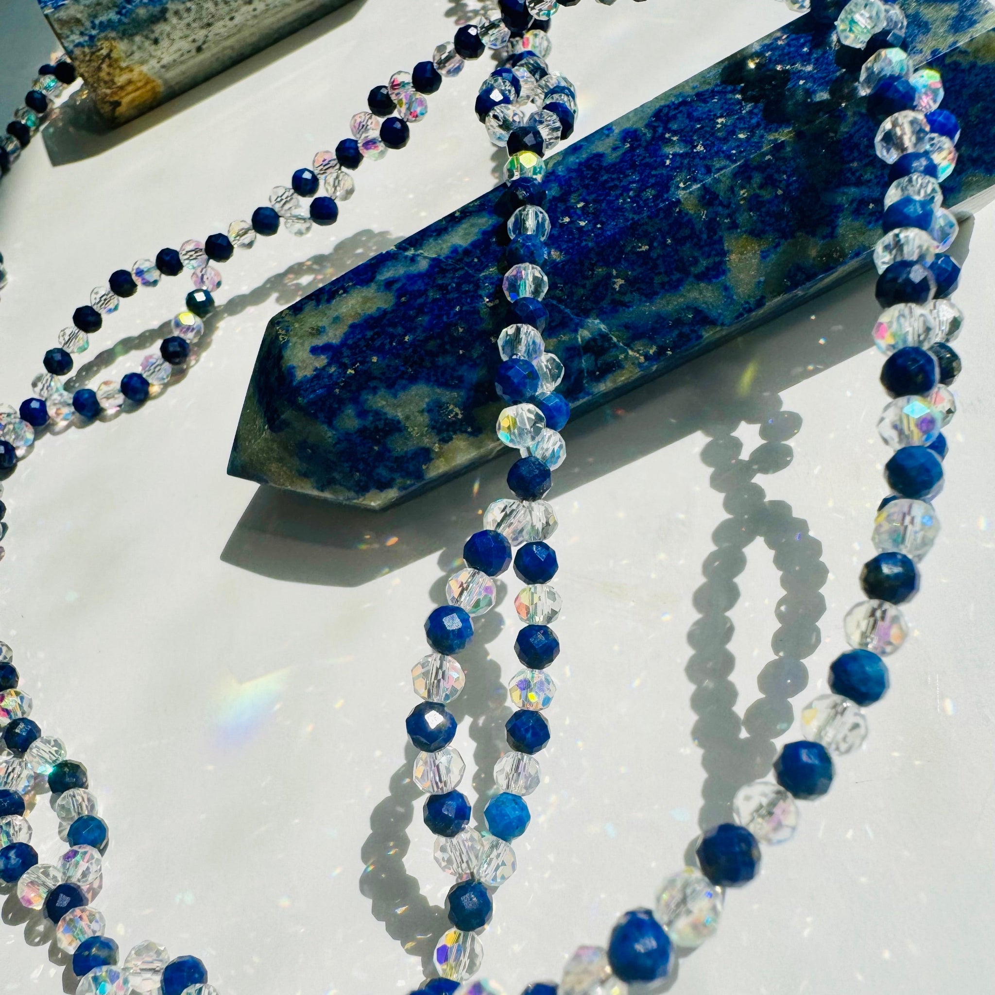 Lapis Lazuli tantric necklace closeup photo on Lapis lazuli tower crystal