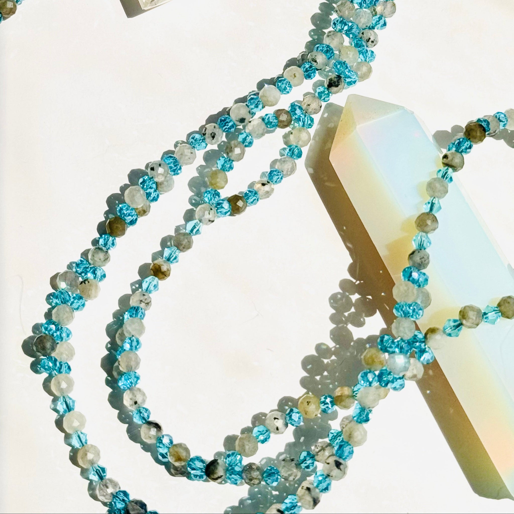 closeup photo of beaded moonstone tantric necklace