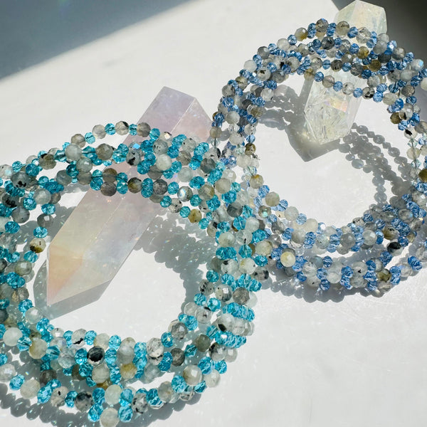 A two-strand Intuition Moonstone Tantric Necklace with intricate geometric designs and a series of round and faceted beads.