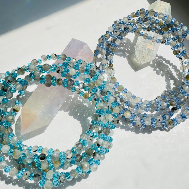 A two-strand Intuition Moonstone Tantric Necklace with intricate geometric designs and a series of round and faceted beads.