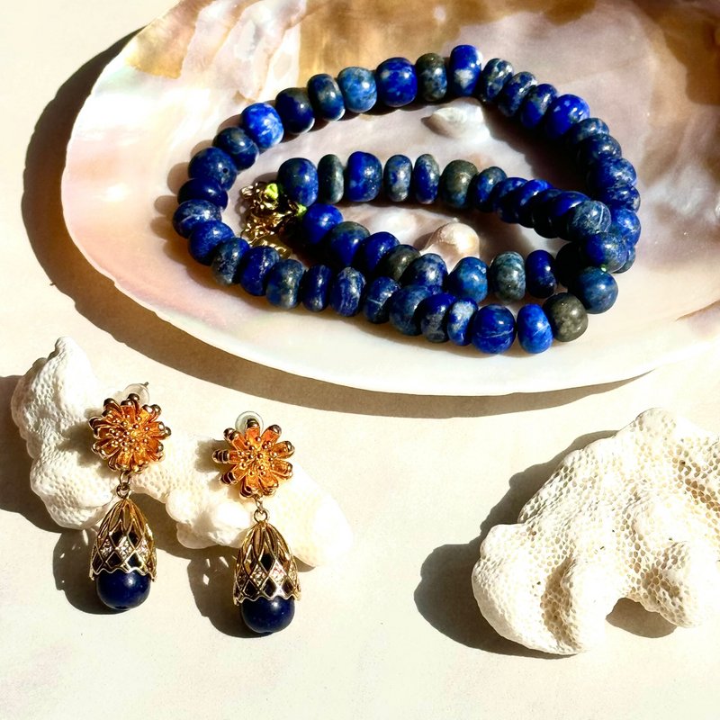 Lapis Lazuli Earrings and necklace on white shell and surface