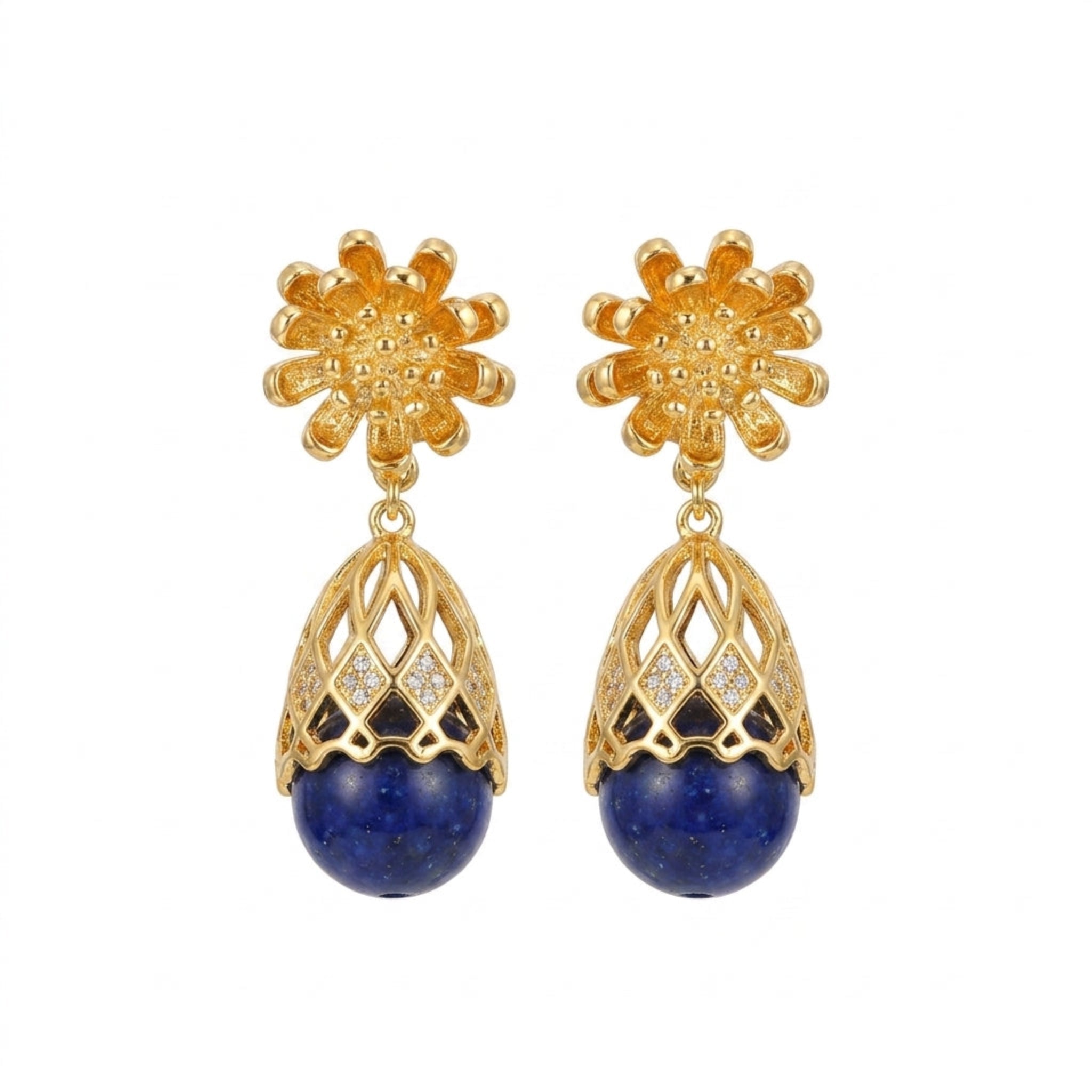A pair of gold-plated dangle earrings featuring a textured flower-shaped stud, an openwork filigree dome with small clear stones, and a round deep blue lapis lazuli stone at the bottom, shown on a plain white background.