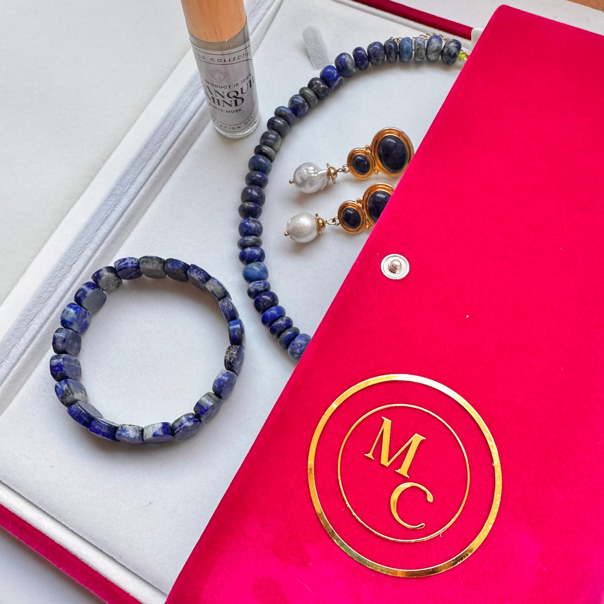 Lapis Lazuli bracelet necklace and earrings and oil in magenta box