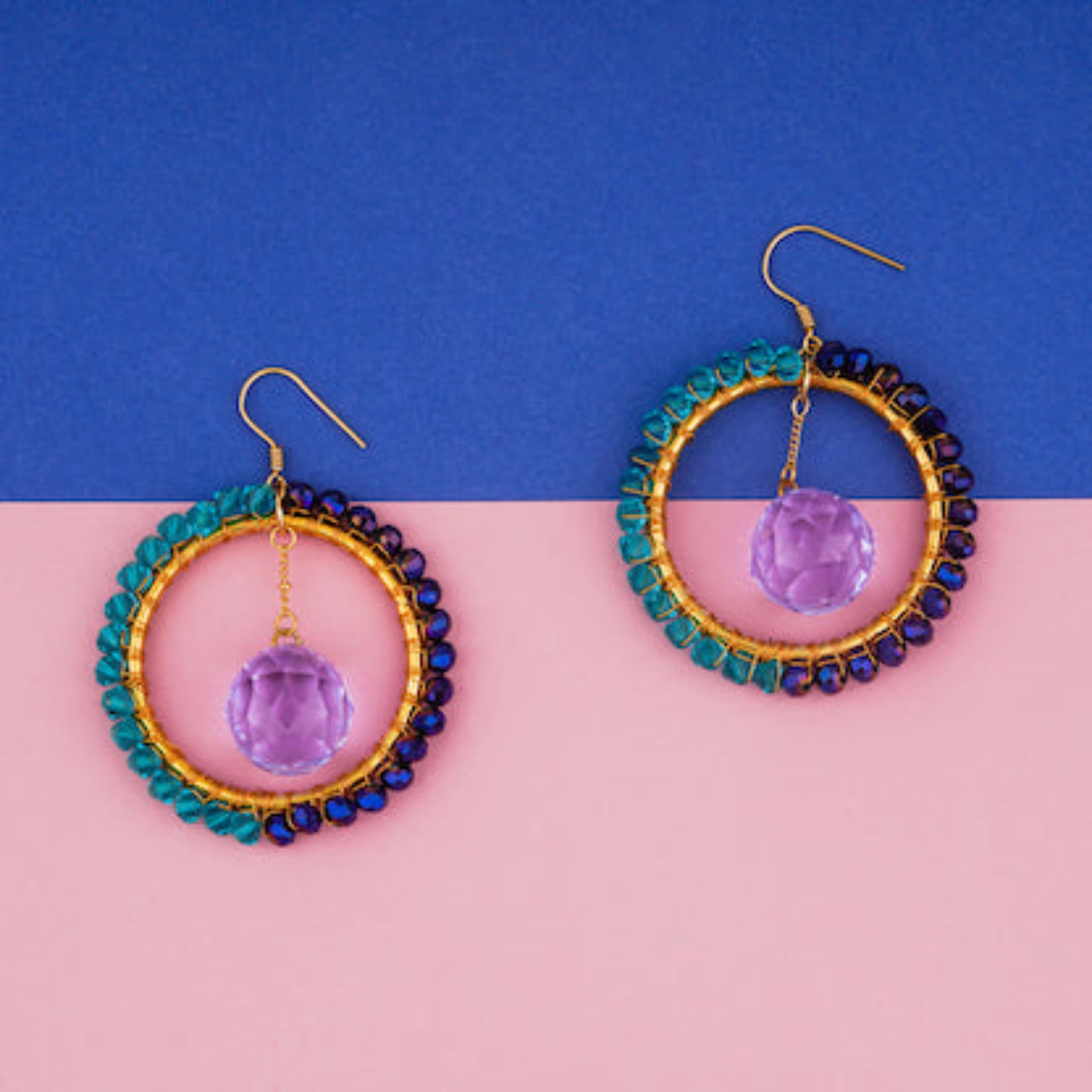 MagneticSuncatcherEarrings on colored surface