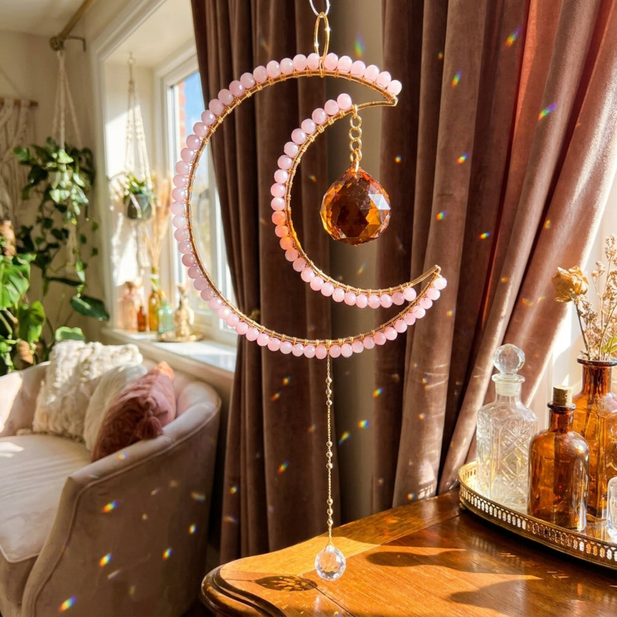 A crescent moon suncatcher talisman in a sacred space creating rainbows.