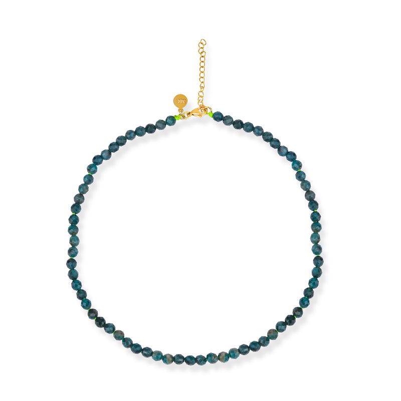 A beaded apatite necklace with a gold plated lobster clasp, featuring vibrant blue beads.