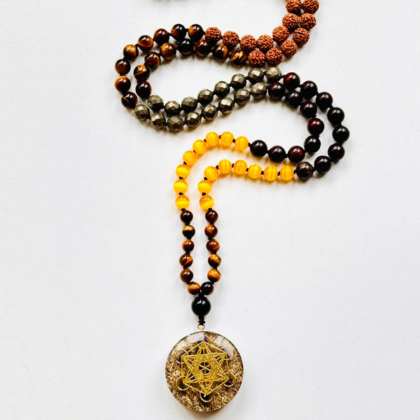 A beaded mala necklace with a Metatron's Cube pendant, featuring various colored beads and a gold-colored pendant.