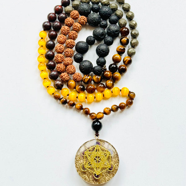 A beaded mala necklace with a Metatron's Cube pendant, featuring various colored beads and a gold-colored pendant.