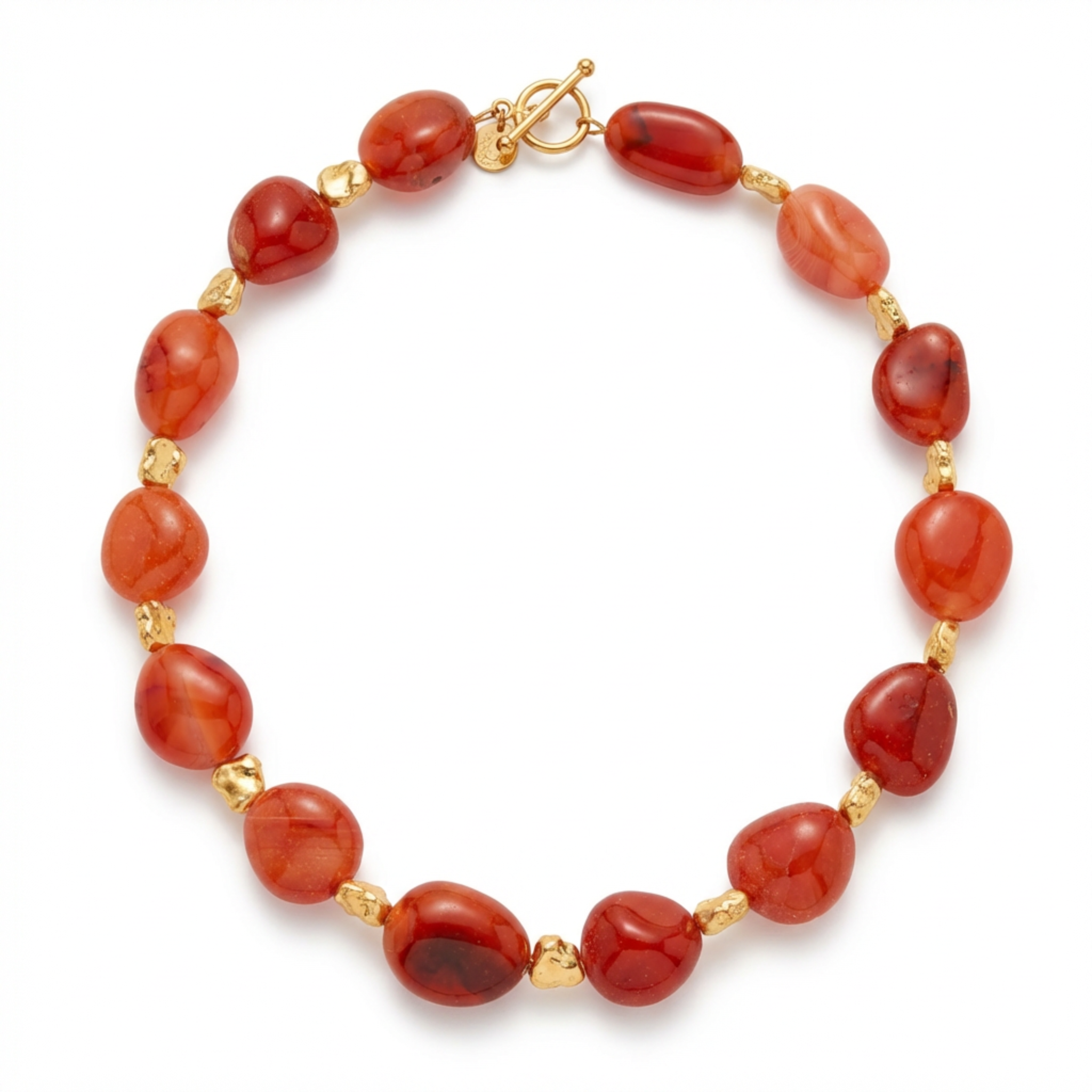 Necklace with red beads and gold accents on a white background