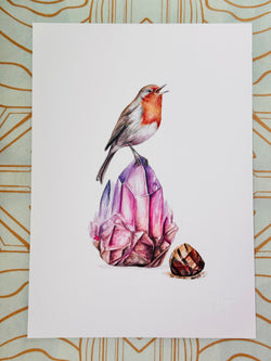 Illustration of a robin on a pink crystal with a gold geometric pattern in the background