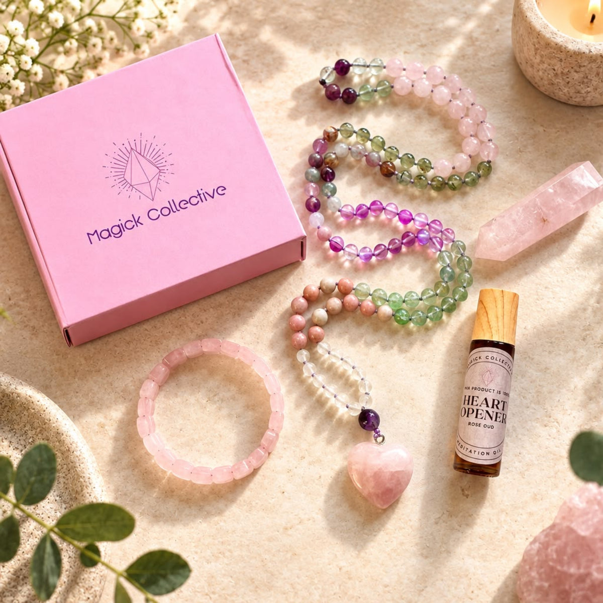 Rose Quartz Ritual Set including a mala, rose quartz bracelet, heart opener oil, and Magick Collective box.
